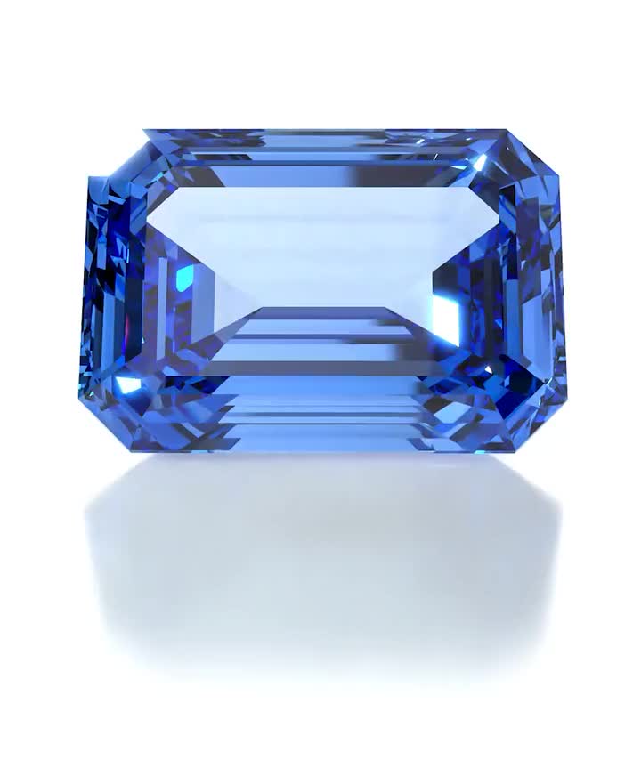 Three-Stone Engagement Ring: white gold, blue sapphire, diamonds